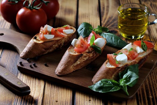 Tranches de pain garnies de tomates, mozzarella et basilic, servies sur une planche en bois avec des tomates et de l'huile d'